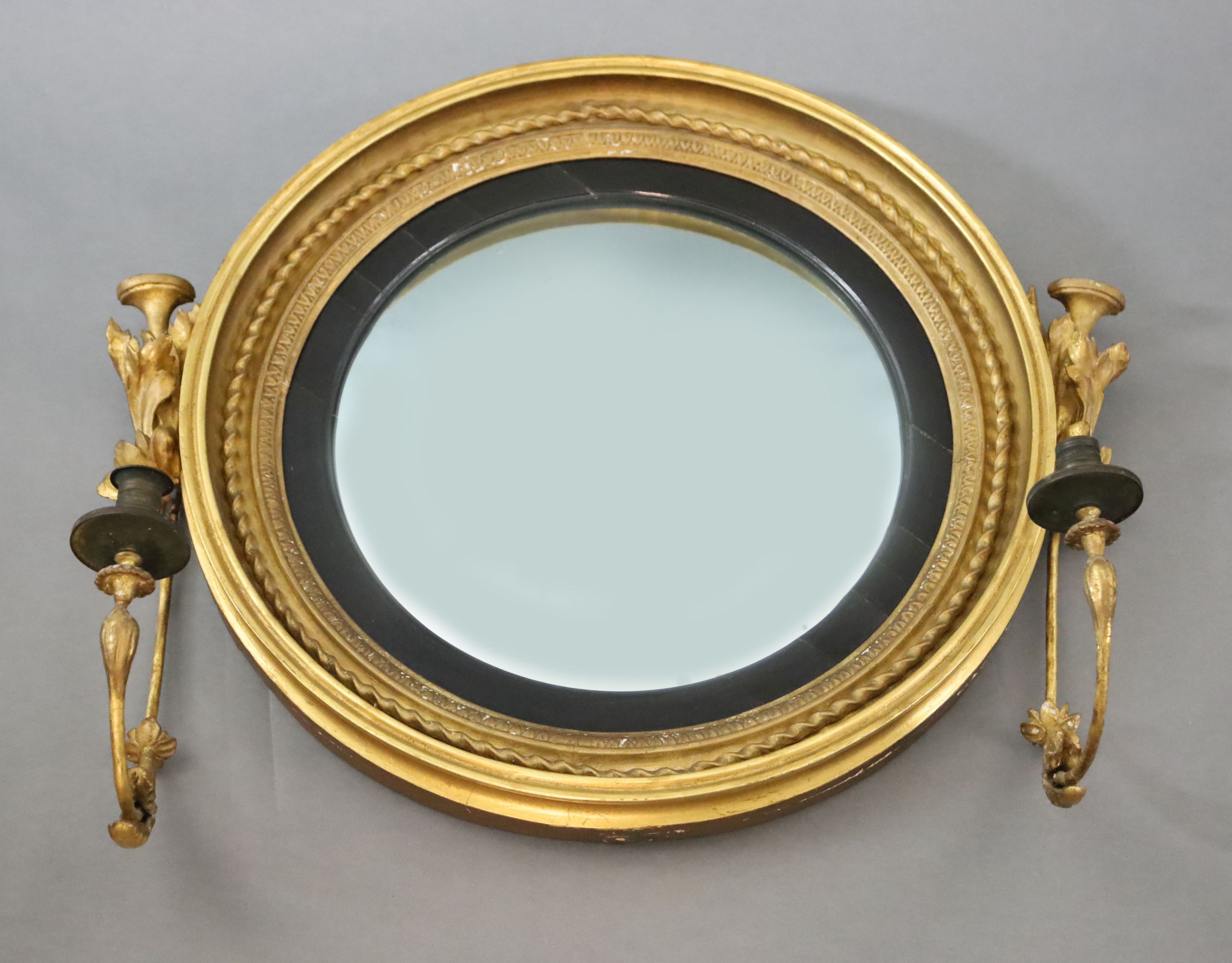 A William IV giltwood and gesso convex girandole, W.2ft 7in. H.2ft 2in.